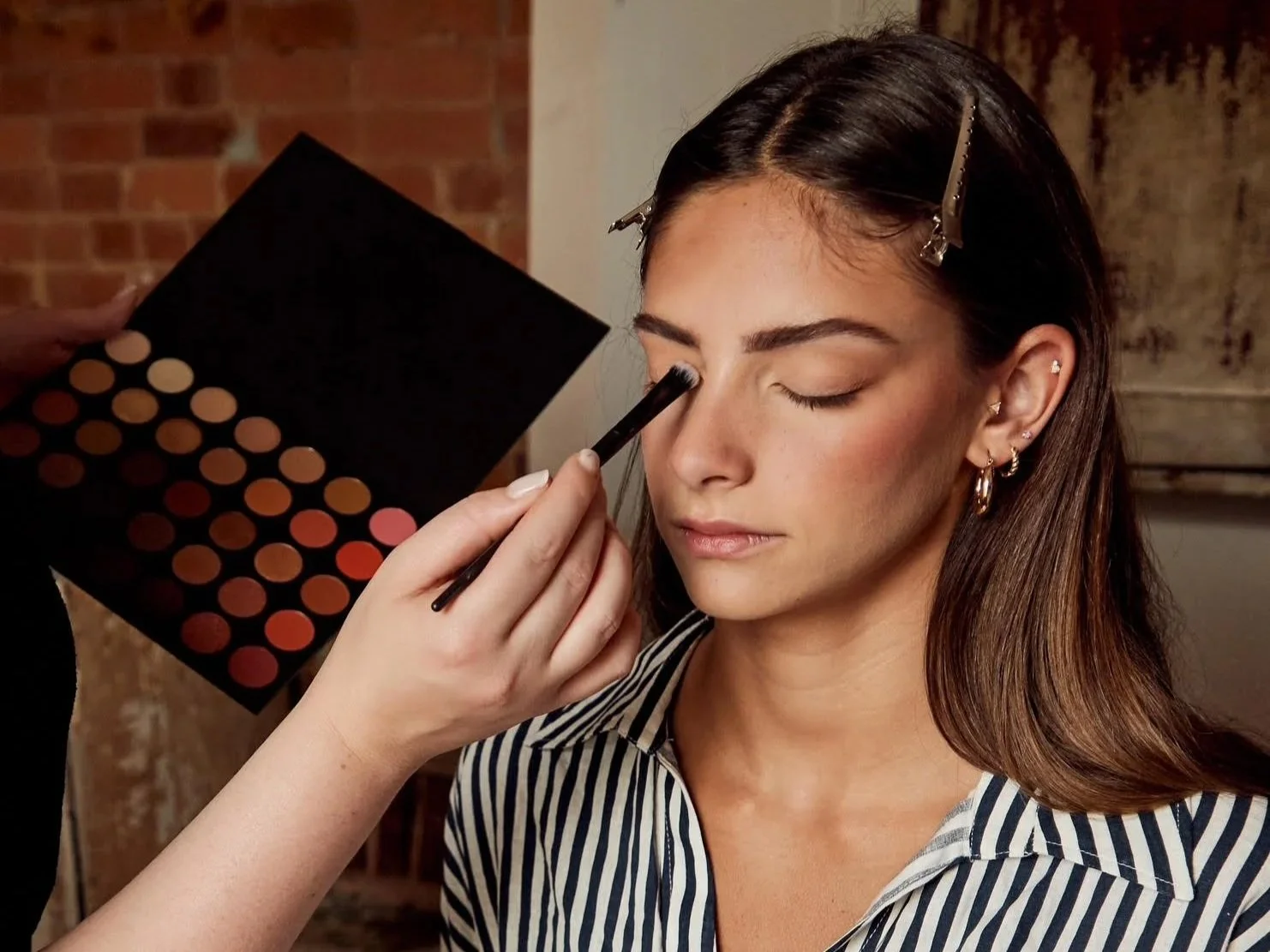 girl getting event makeup done