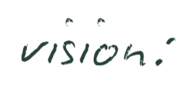 Close-up of a black surface with the word 'vision' written in lowercase green script and a small green dot at the end.