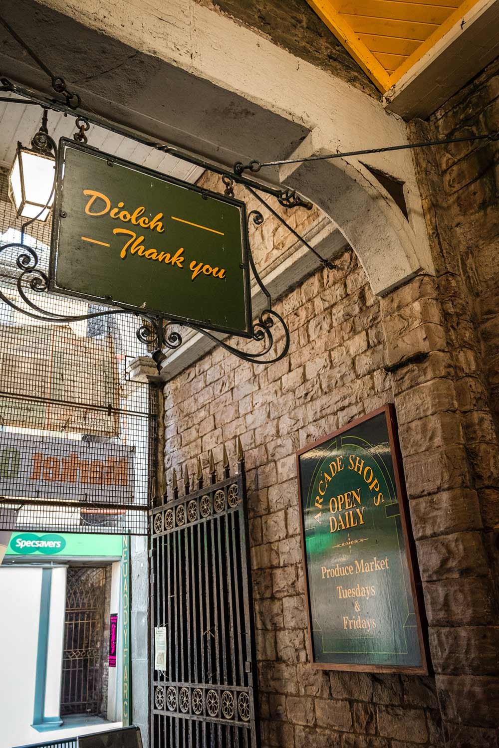 A sign saying 'diolch, thank you' on the way out of Brecon Market Hall in Powys.