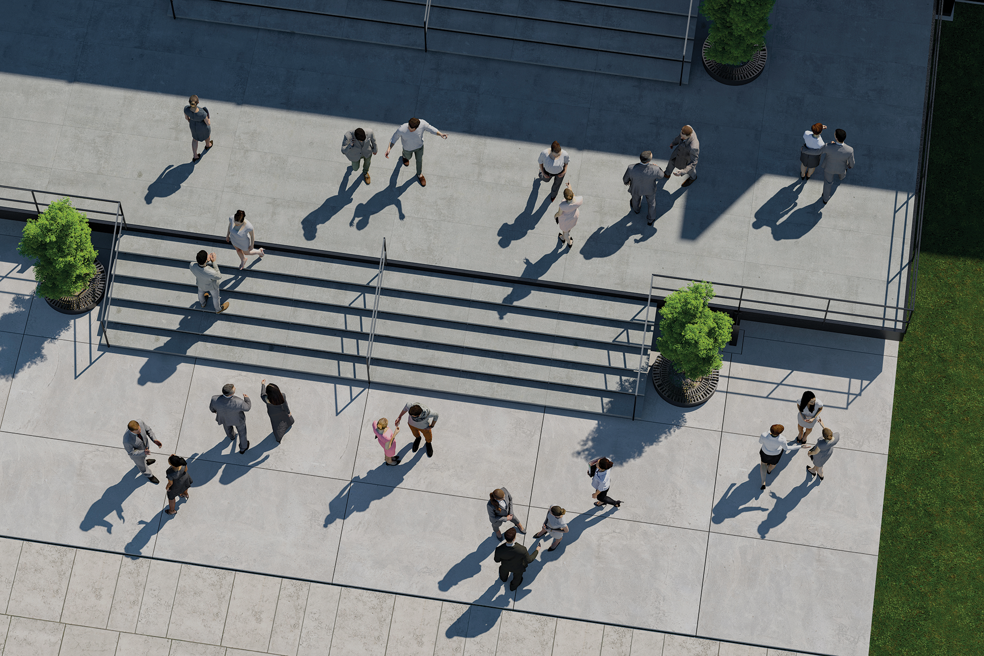 Overhead shot of multiple small groups of people talking outside on the steps and landings outside of a business building