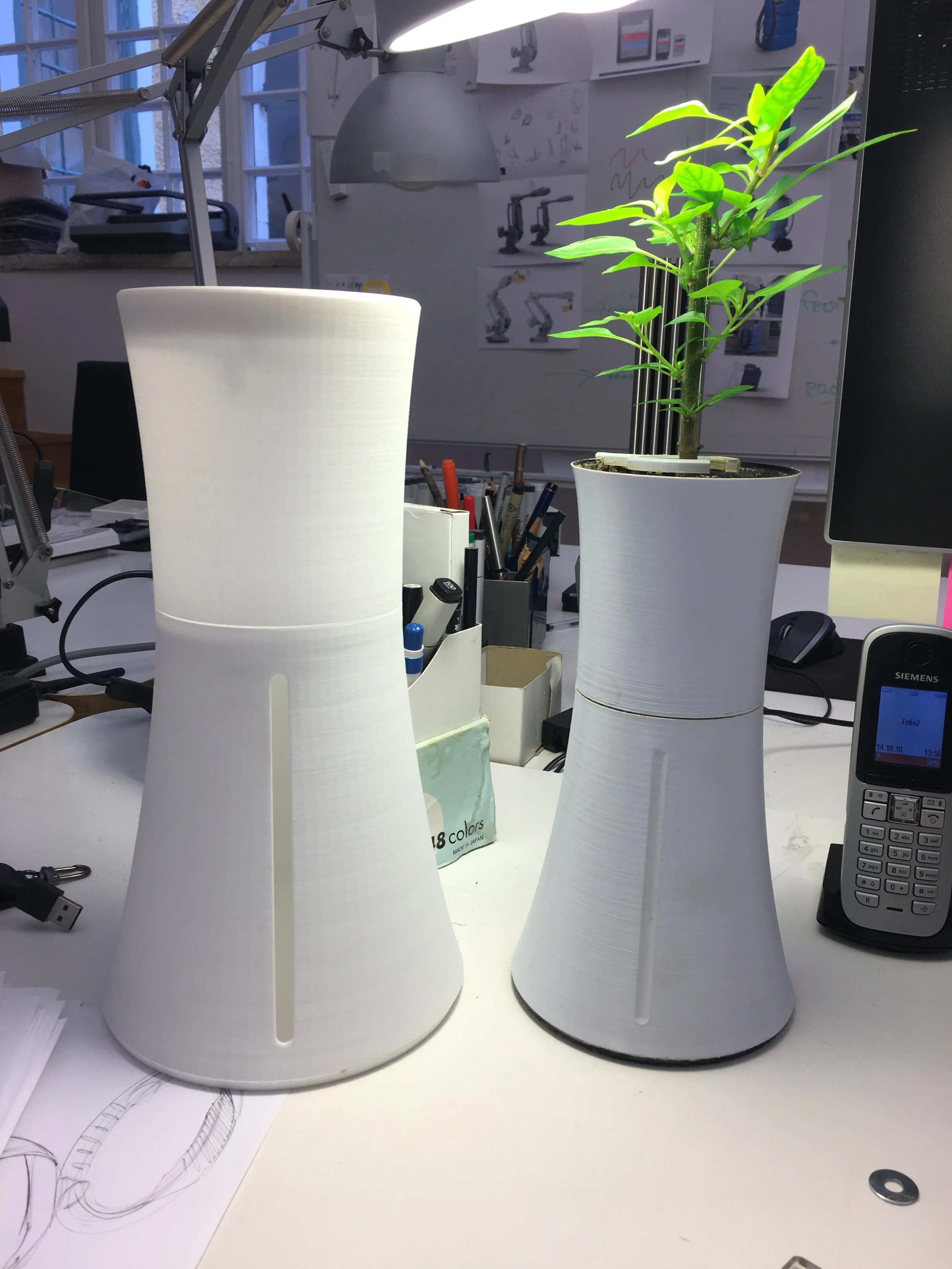 New prototype (left) - re-modeled for injection moulding instead of 3d-printing. The final product was somewhere in between them in size.