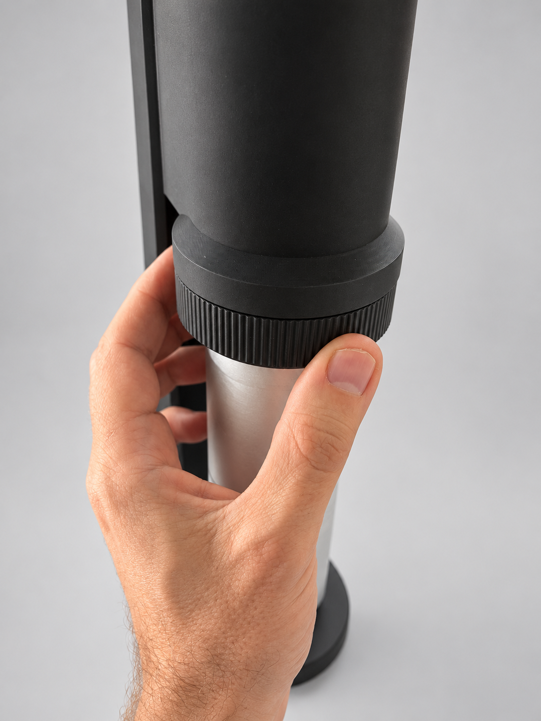 Rotate to remove grinder and add beans and adjust grind size