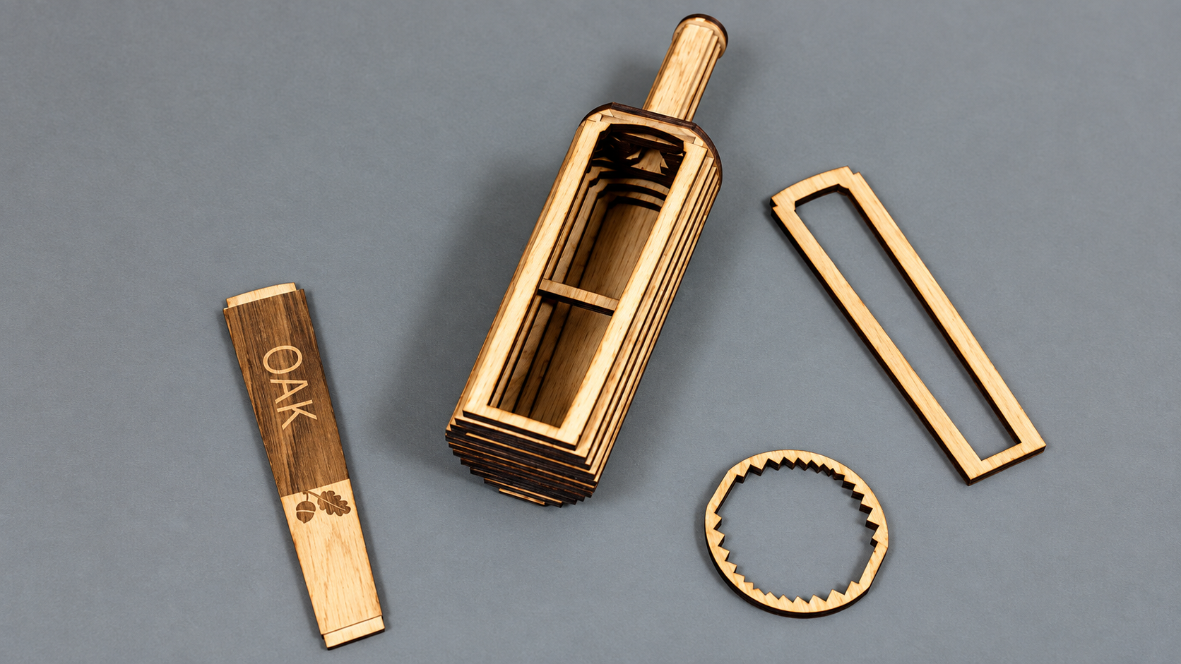 The oak bottle is composed of laser cut segments of oak held together with aluminum frames. This earlier version of the oak bottle used wooden frames for holding it together - which turned out to be too weak. The charred surfaces that the laser cutti
