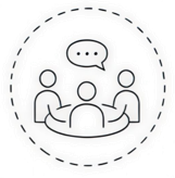 Four people sitting around a table having a discussion, with a speech bubble above them.