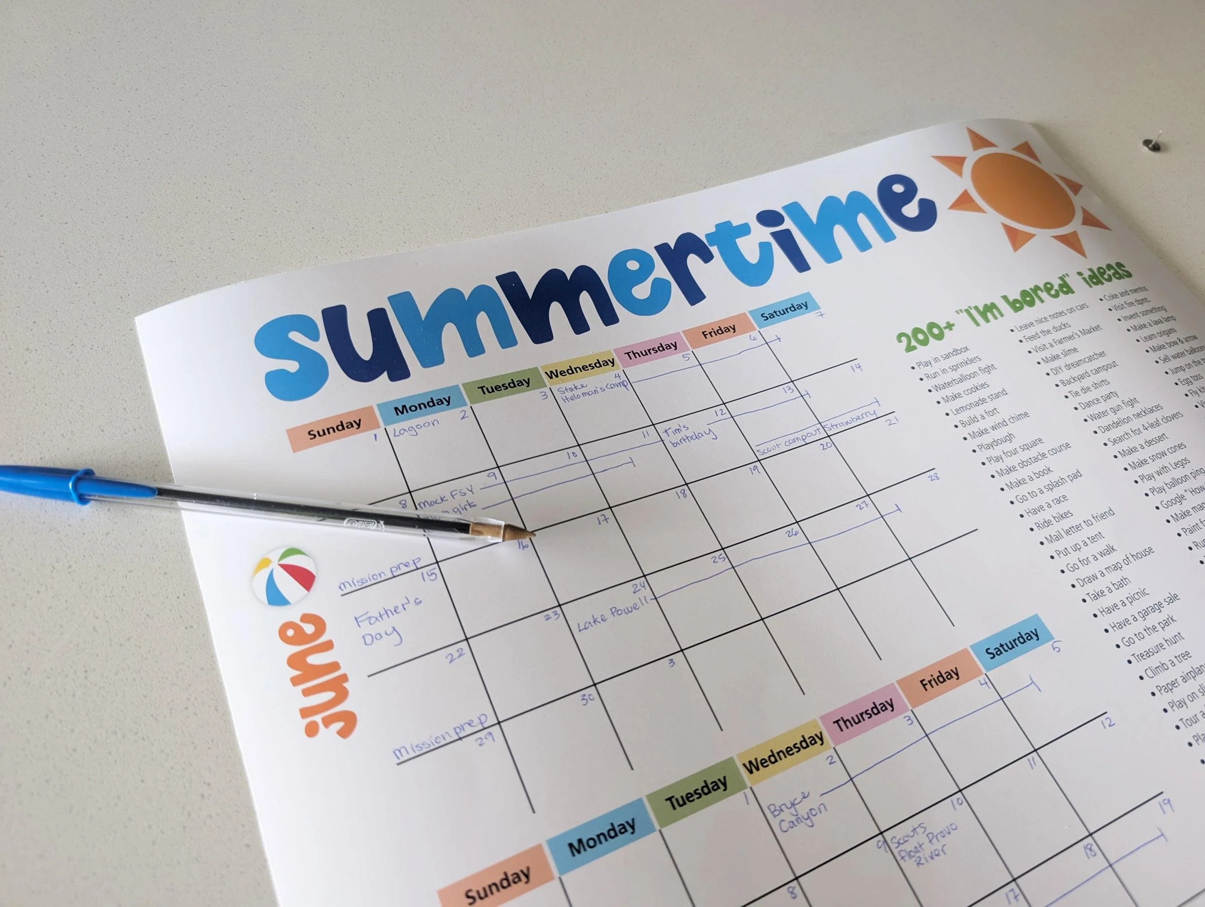 Parent creating a summer holiday parenting plan and family schedule