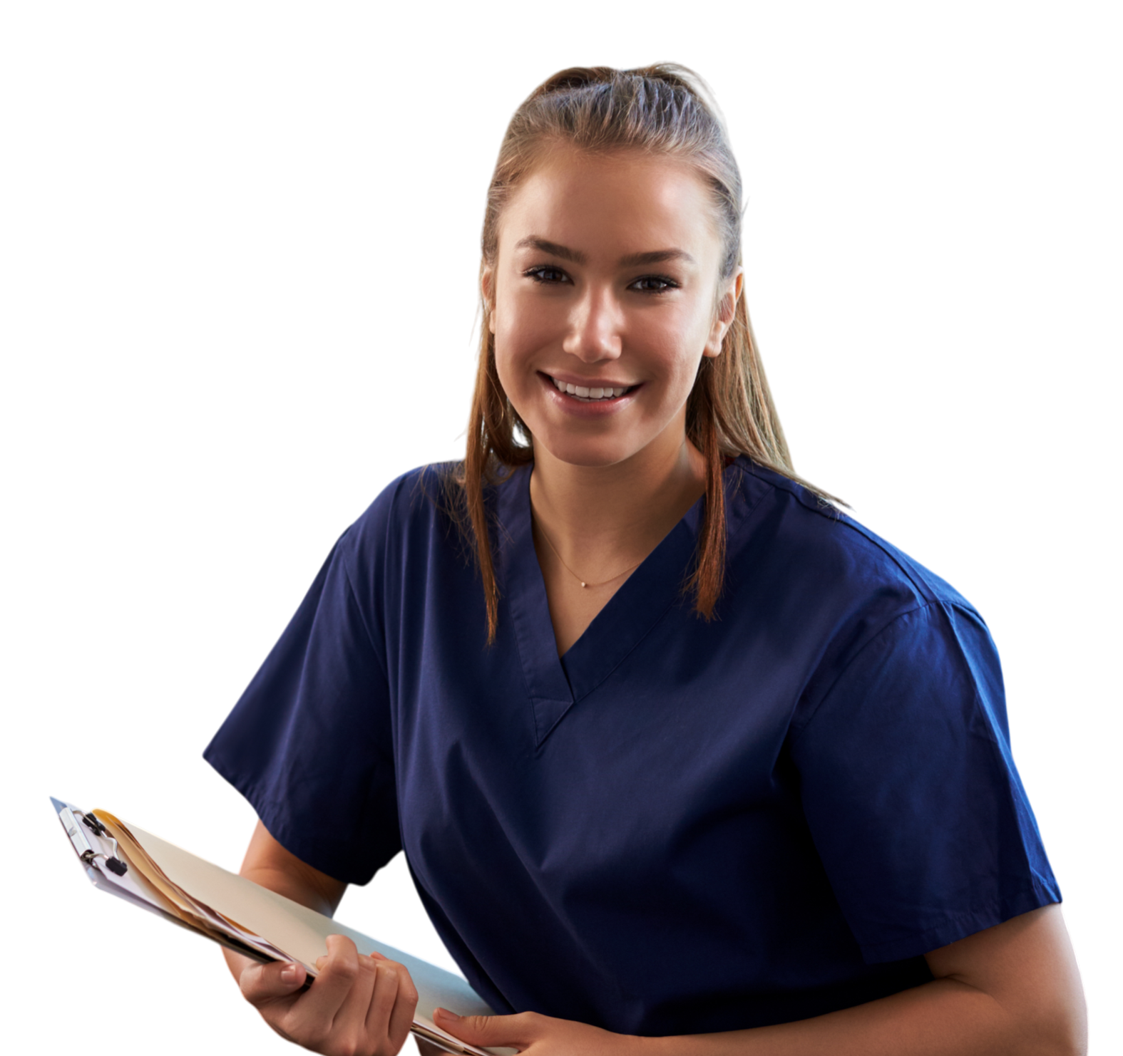 A young woman in navy scrubs holding a clipboard, smiling at the camera