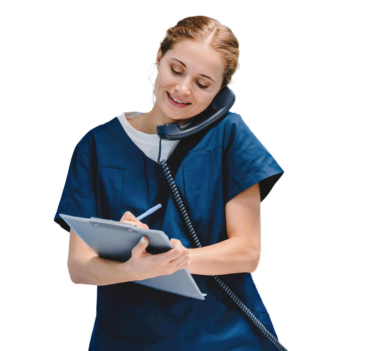 Female nurse in blue scrubs talking on a landline phone and writing on a clipboard, smiling.