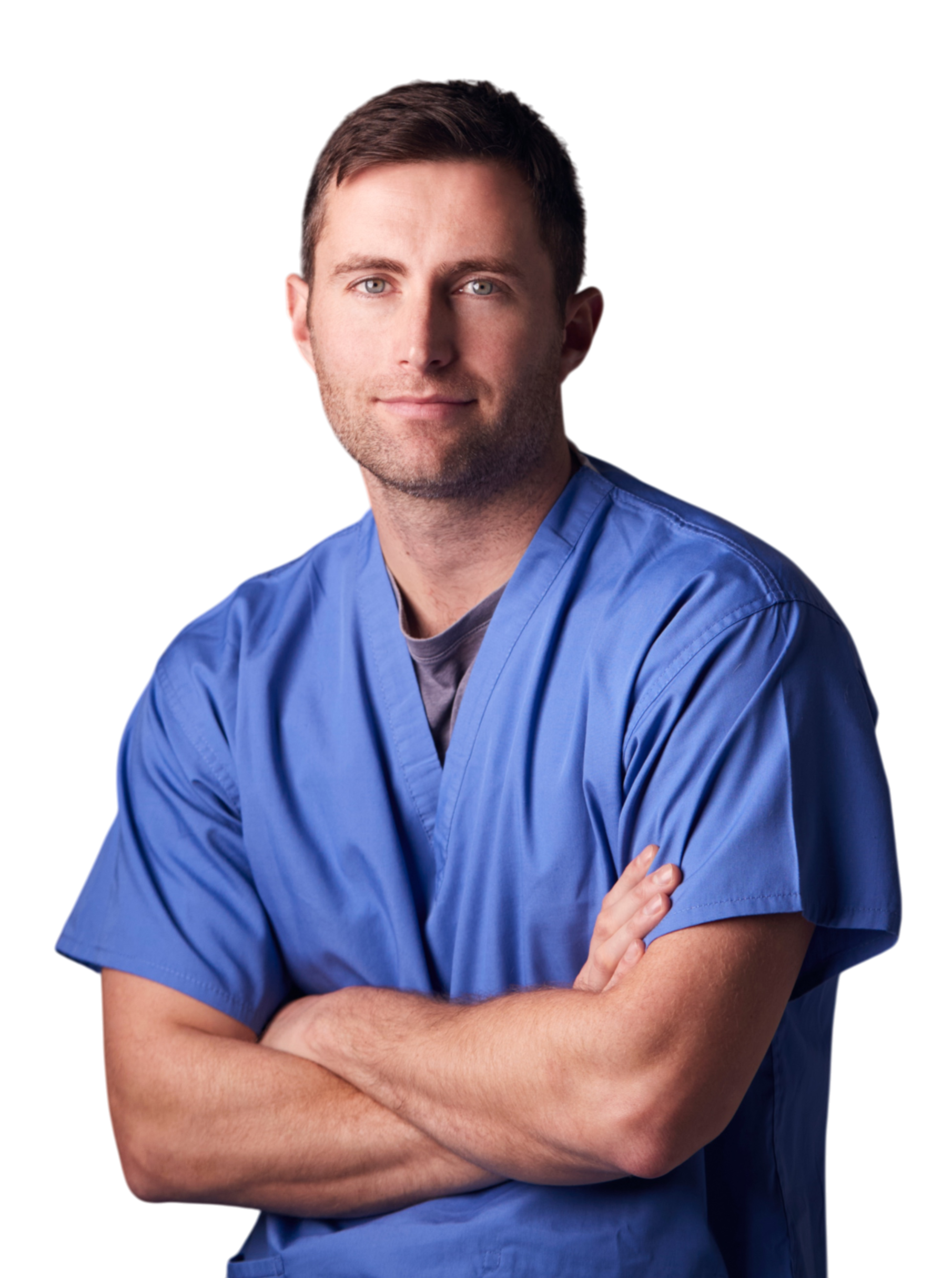 Portrait of a young male healthcare professional wearing blue scrubs, arms crossed, smiling slightly, against a black background.