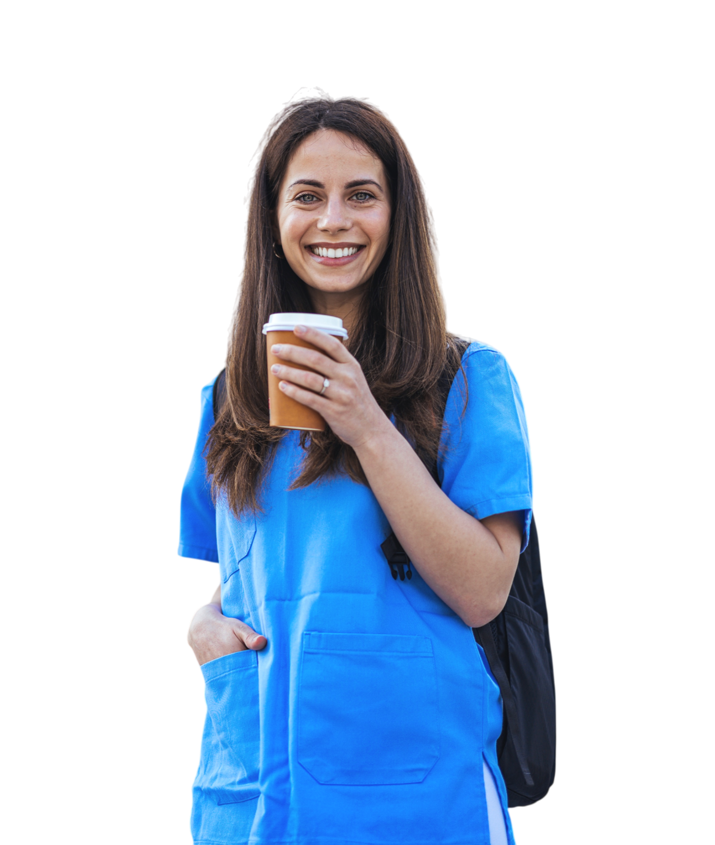 A smiling woman in blue medical scrubs holding a disposable coffee cup, with a backpack on her shoulder.