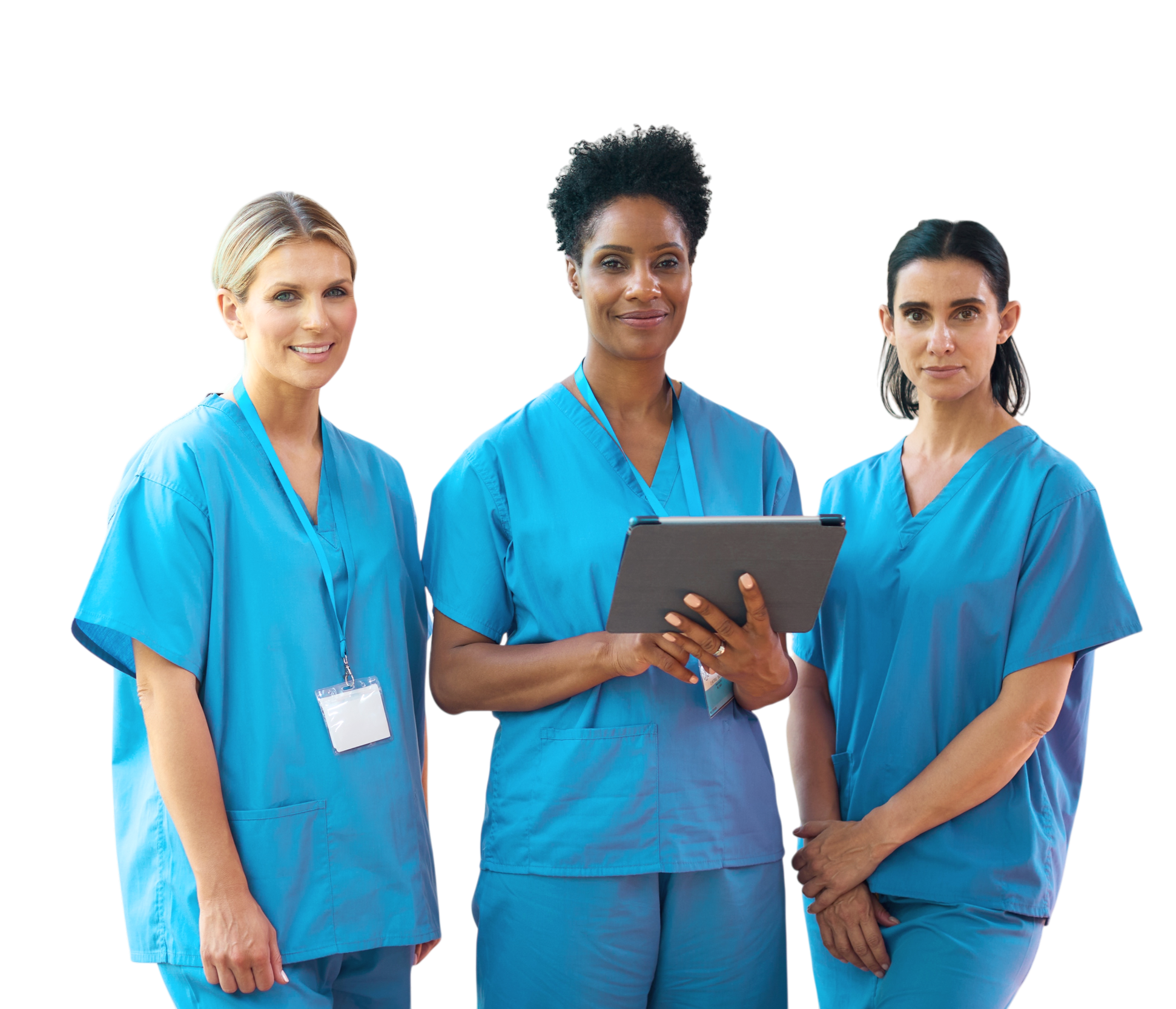 Three female healthcare professionals in blue scrubs standing together, with the woman in the middle holding a clipboard.