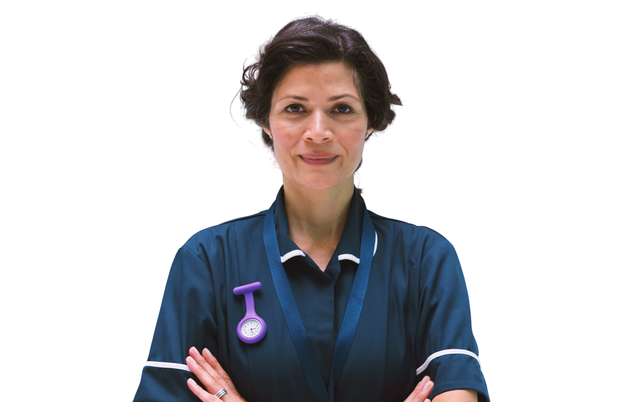 A female healthcare professional in a dark blue uniform with white accents and a purple stethoscope badge, standing with arms crossed, smiling confidently.