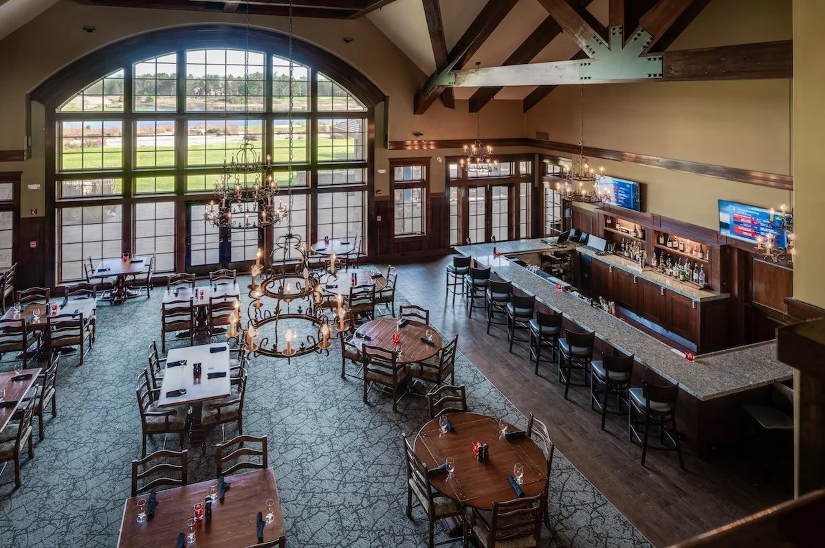 Main Dining Room at the Forest Dunes clubhouse featuring exposed wood beams and natural light