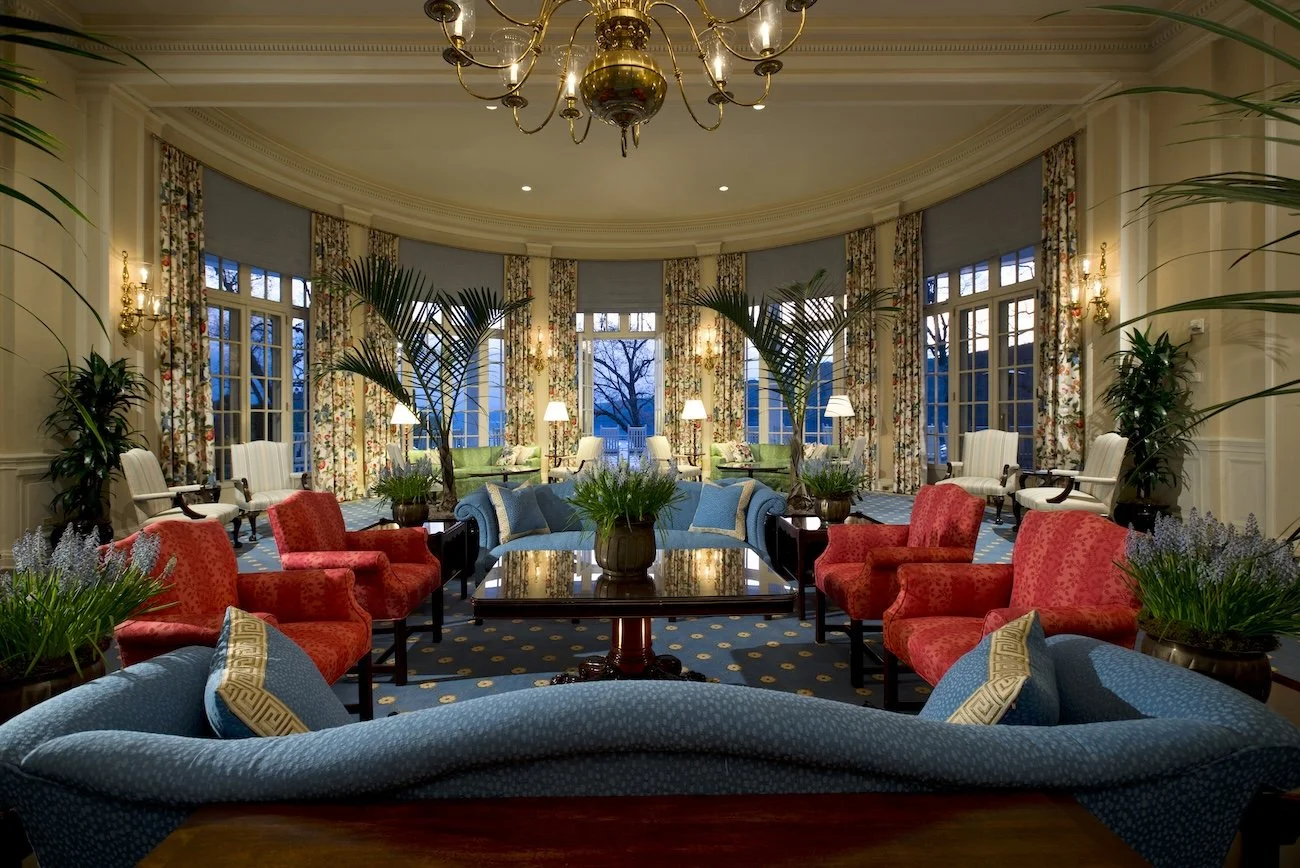 The lobby of the Otesaga Resort Hotel, with sofas and armchairs arranged for conversation.