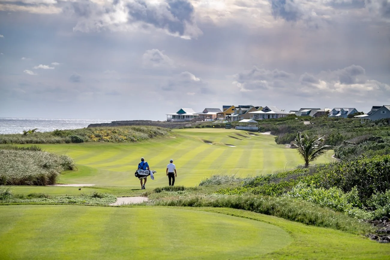 The 18th hole at The Abaco Club with the sea visible alongside the fairway