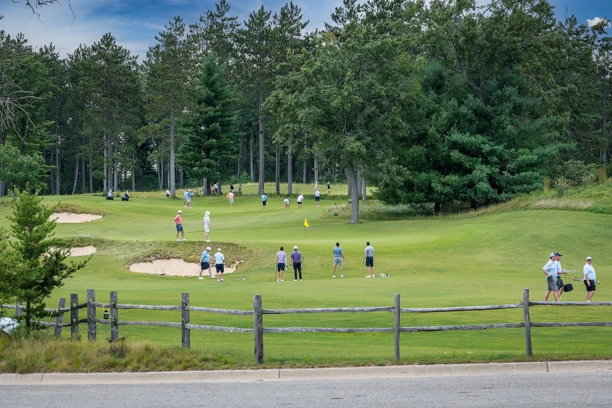 Golfers enjoying the relaxed atmosphere at the Bootlegger short course at Forest Dunes