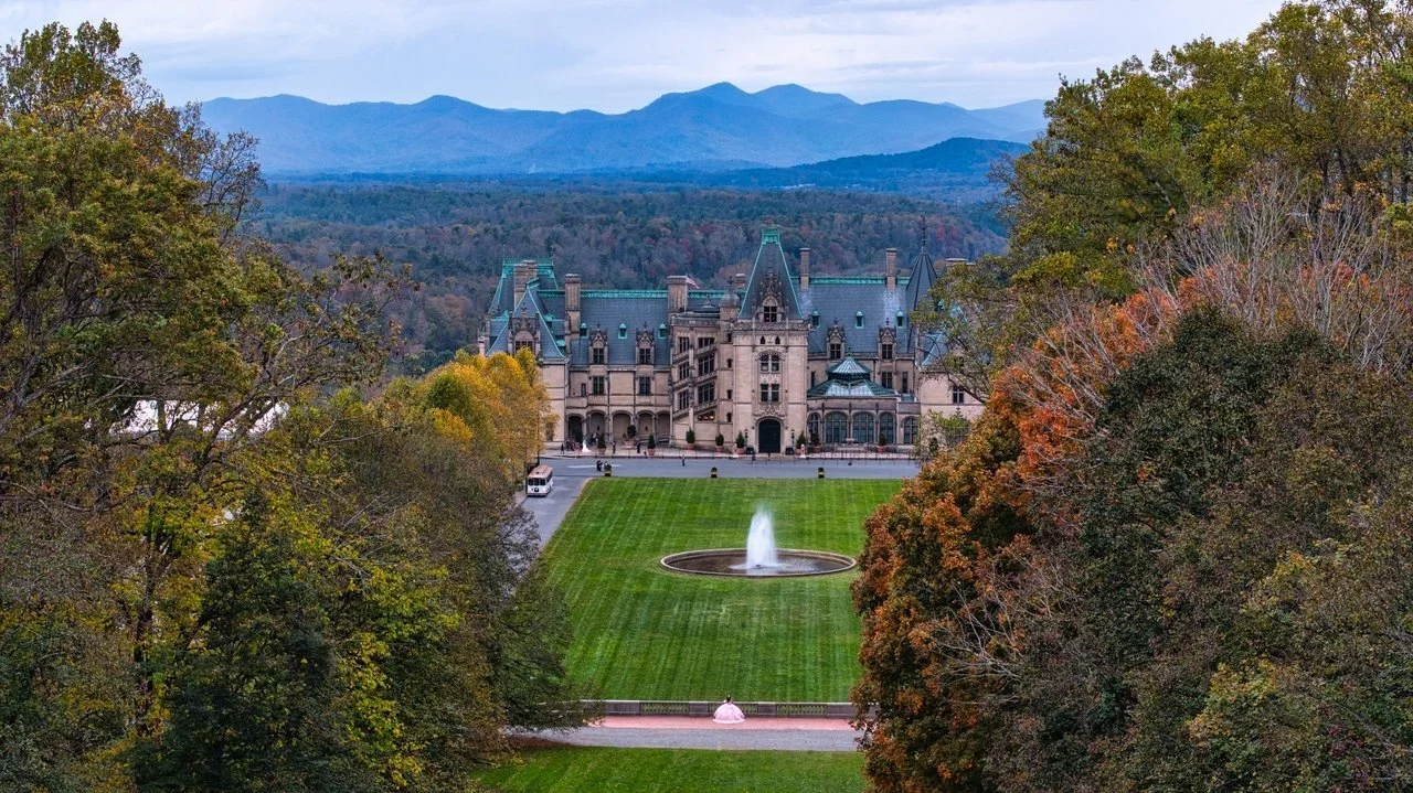 Aerial view of the Biltmore Estate with the Blue Ridge Mountains beyond