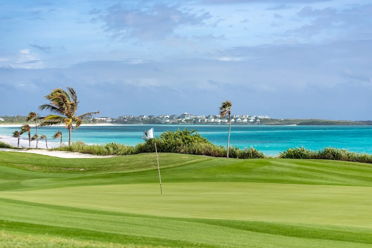 Breezy conditions whip a flagstick on The Abaco Club's links-style golf course