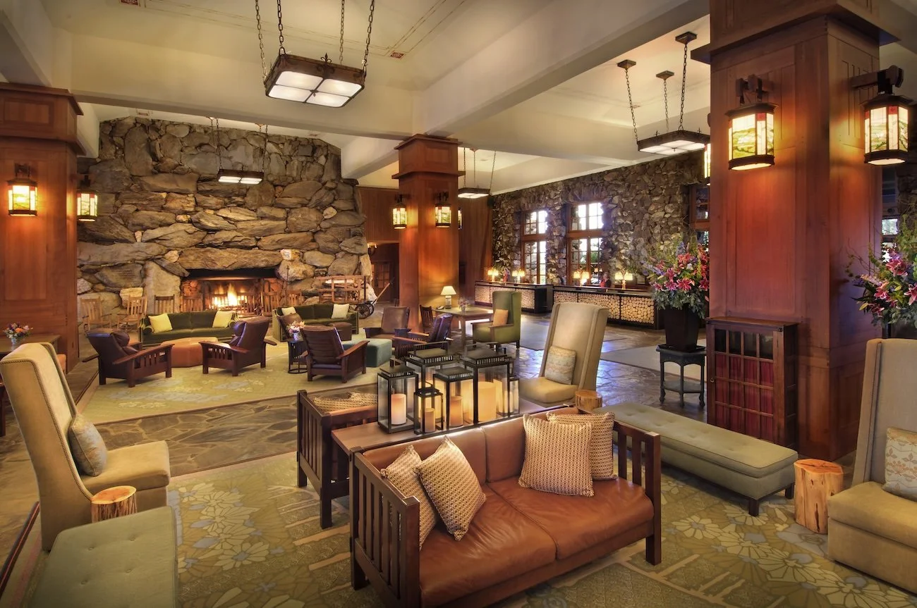 Arts and Crafts-style furnishings in the Great Hall of the Omni Grove Park Inn with the front desk on the right.