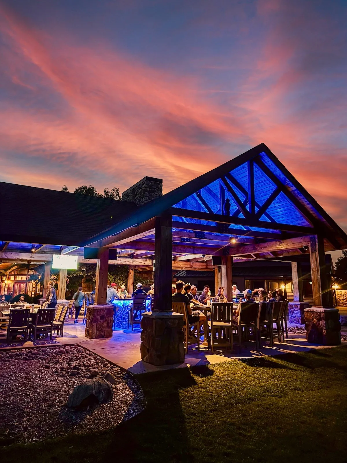 Guests relaxing at the open-air Bootlegger Bar at Forest Dunes