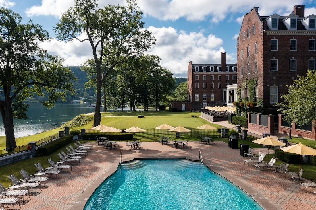 Sunlight on the Otesaga's pool, with  Lake Otsego beyond the hotel grounds.