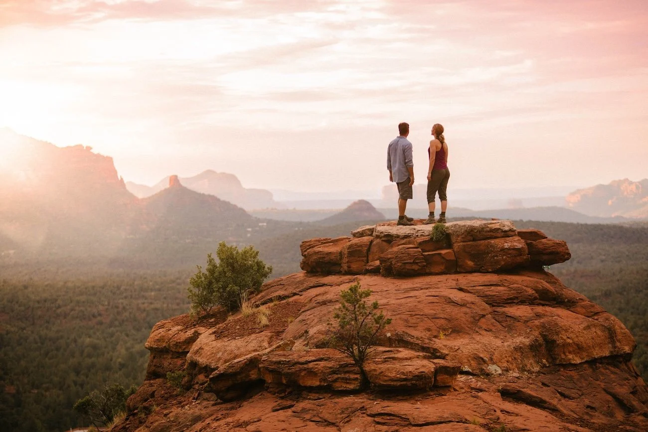 Hikers on a red rock summit near Enchantment Resort in Boynton Canyon Sedona