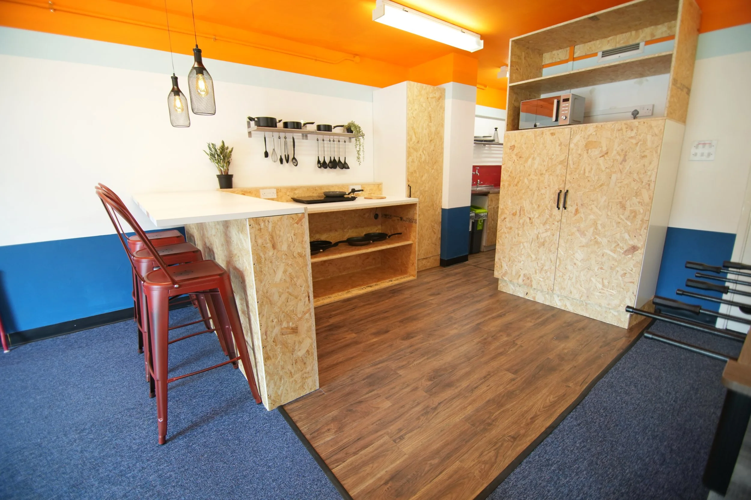 The extension of the kitchen played on the notion of the "kitchen being the heart of the home". Its positioning was central to the space and close to the primary entry points of the mess decks making this an unavoidable area. Whether somebody is in t
