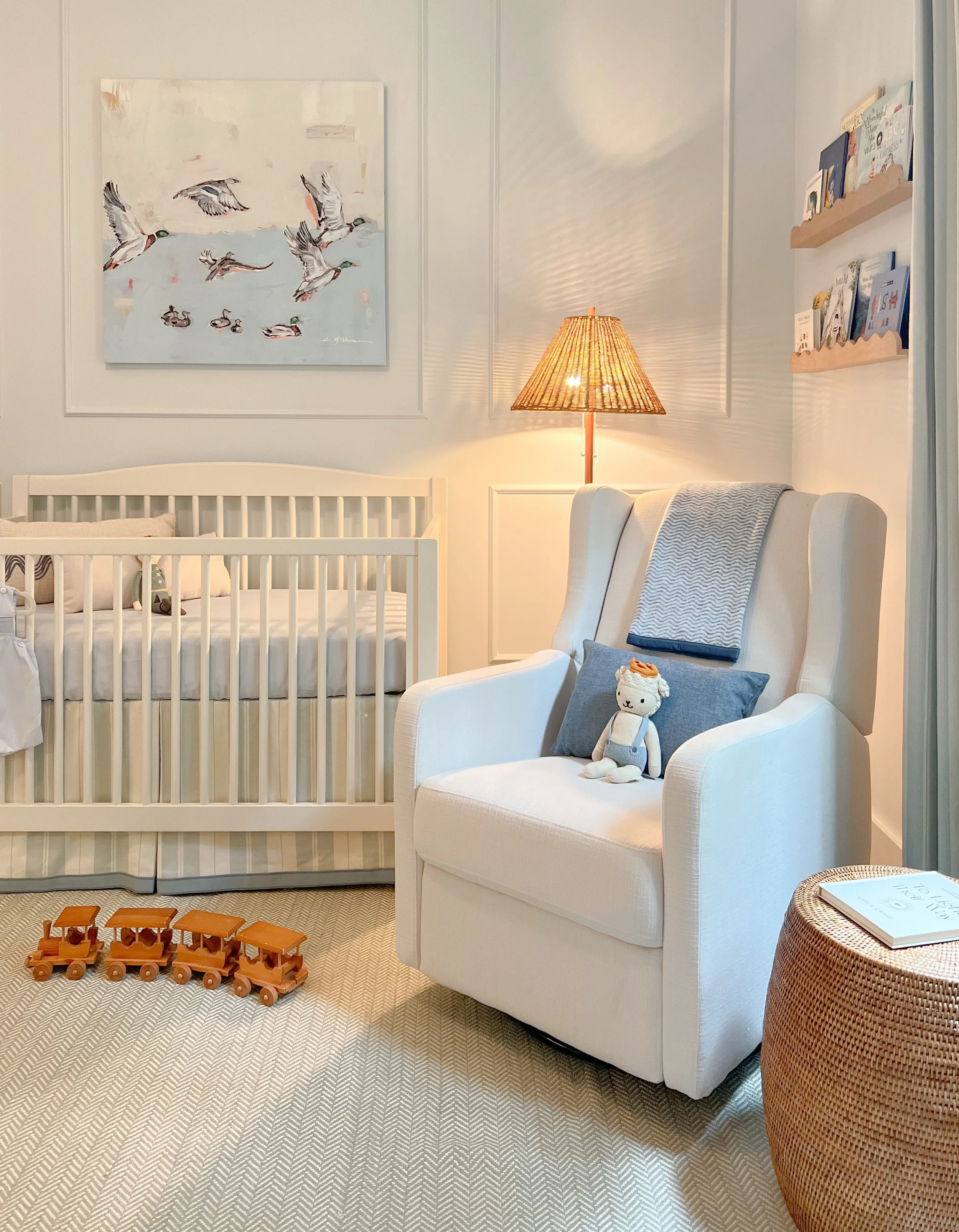 Boy rooms should be just as sweet and playful as girl rooms, and this nursery was no exception. With ceilings over 10 feet tall, we added classic wall paneling (a kit from Etsy!) to bring warmth and balance to the space. Millwork like this is one of 