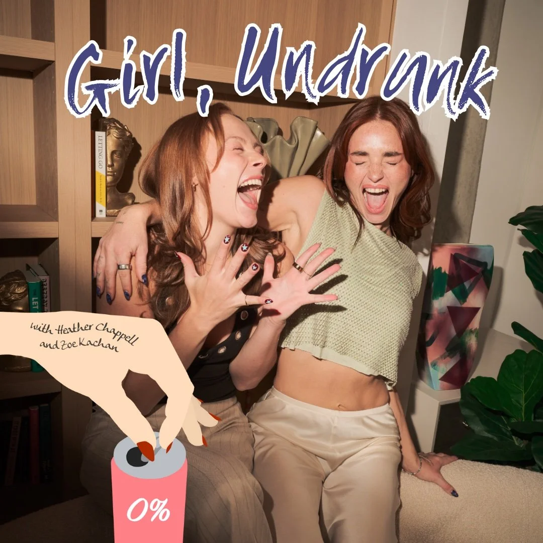Two women laughing and hugging, with one wearing a crop top and the other with long hair, in front of a bookshelf and a decorative vase, with overlay text that says 'Girl, Undrunk' and an illustration of a hand opening a soda can with '0%' on it.