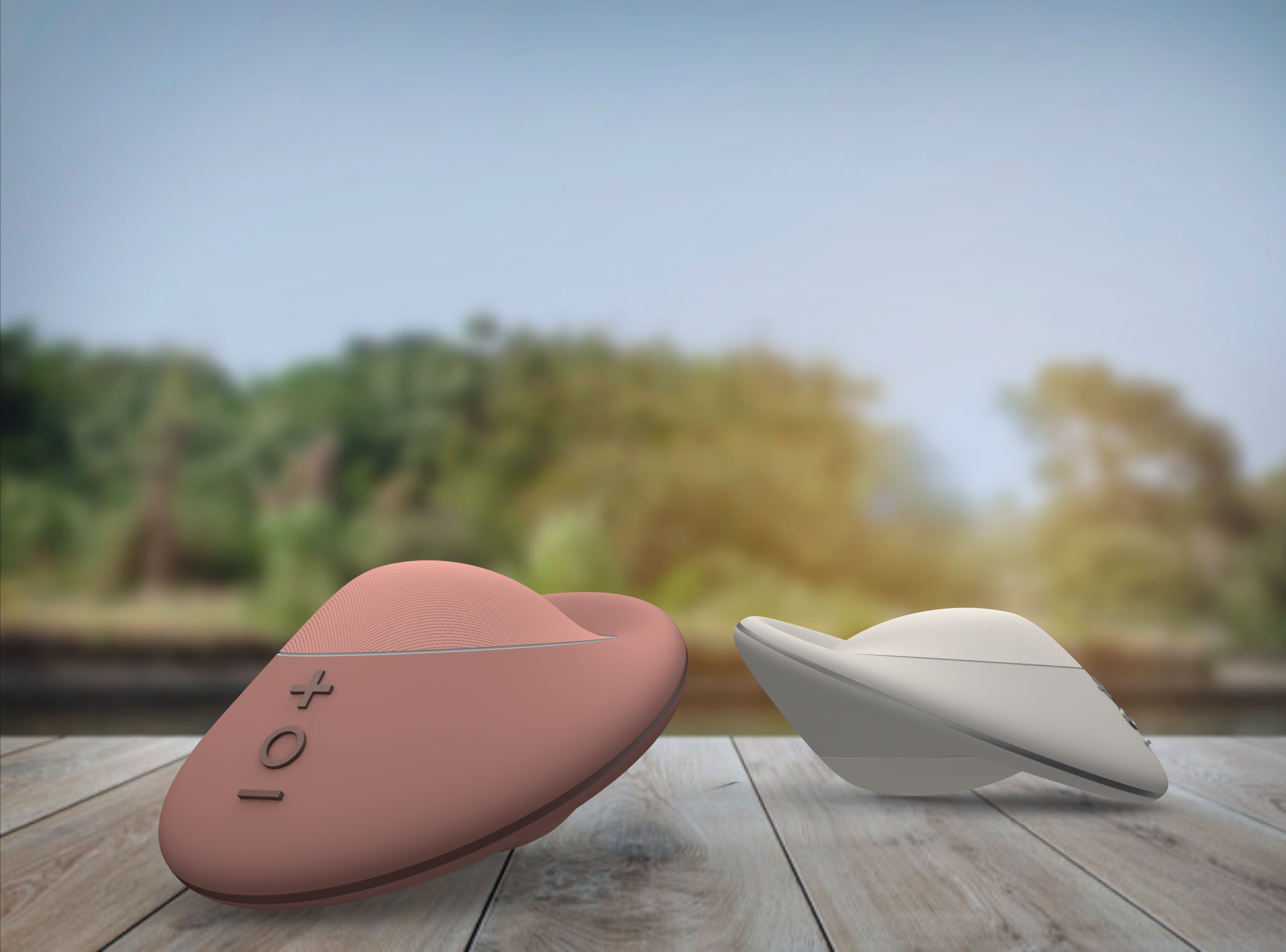 Pink and white portable speakers placed on a wooden surface outdoors with trees and blue sky in the background.