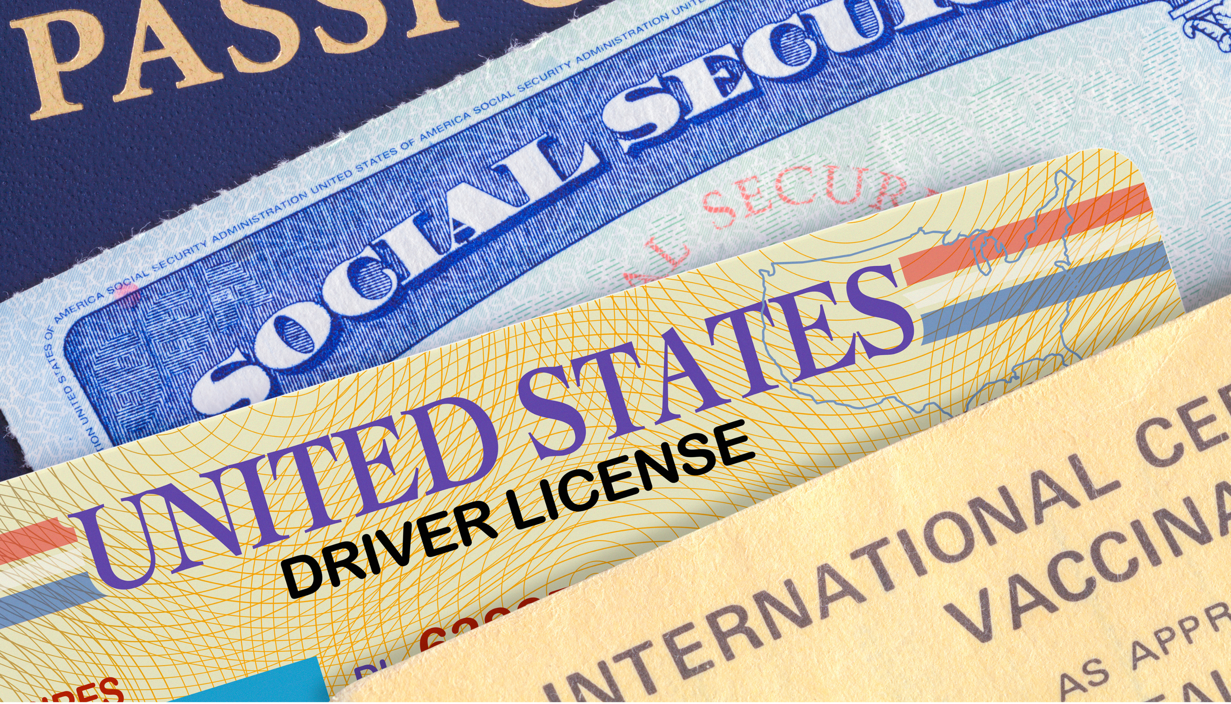 Close-up of U.S. passport, driver's license, and vaccination card inside an envelope.