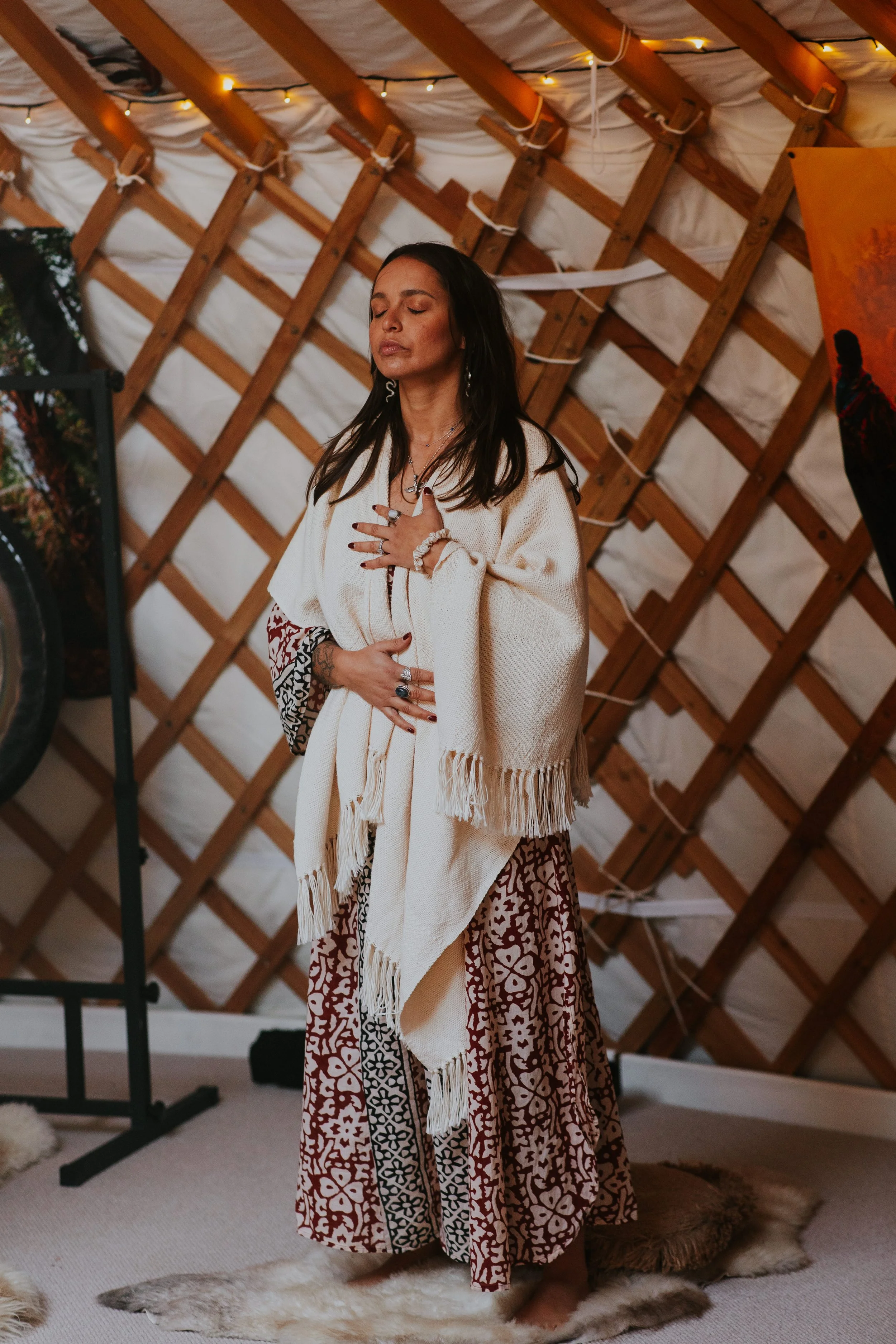Suia standing up in a healing ceremony