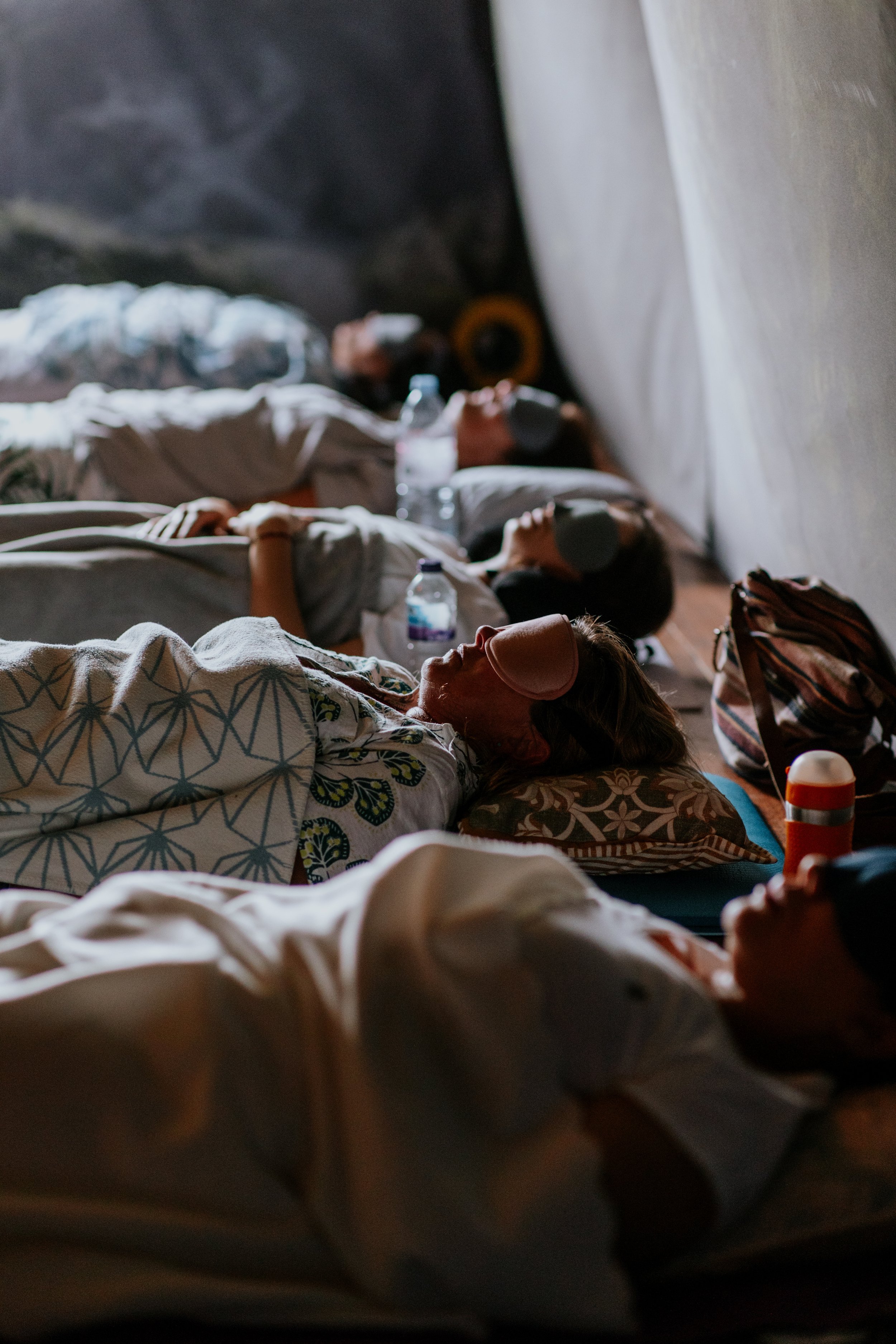 participants lying down with facemasks at event