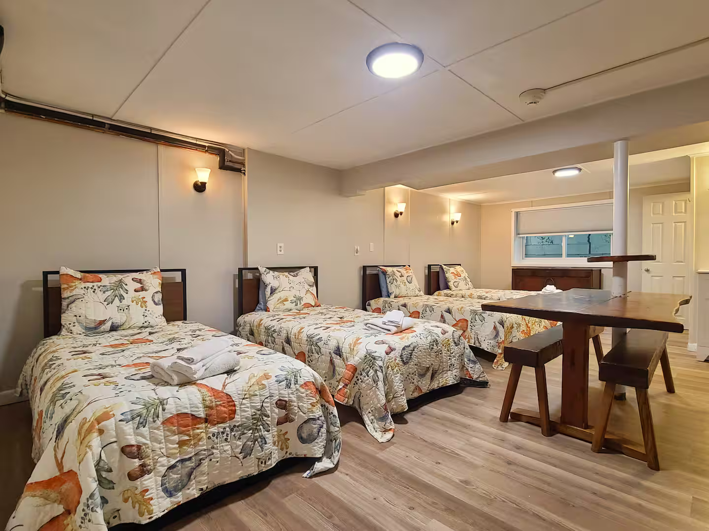 Bedroom 6 – Activity Bunk Room
4 Twin beds | Lower level | Attached 3/4 bathroom

The ultimate kids' headquarters with sleeping for 4+, a table with benches for games and crafts, and direct bathroom access. A favorite for young guests!