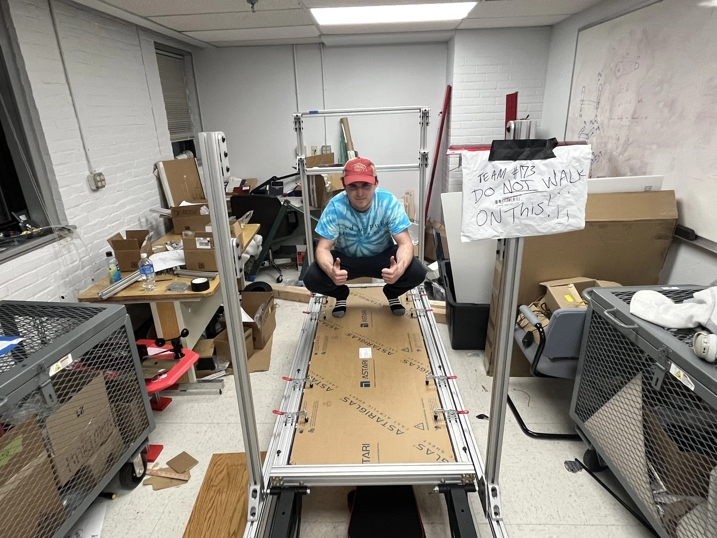 Alex sitting on the walkway now that the acrylic is on top! The protective sheet is still on the sheet for no scratching