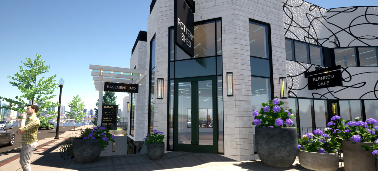 Modern commercial building with large glass windows, potted purple flowers outside, signs indicating Basement Jaxx and Blended Cafe, and a man standing on the sidewalk.