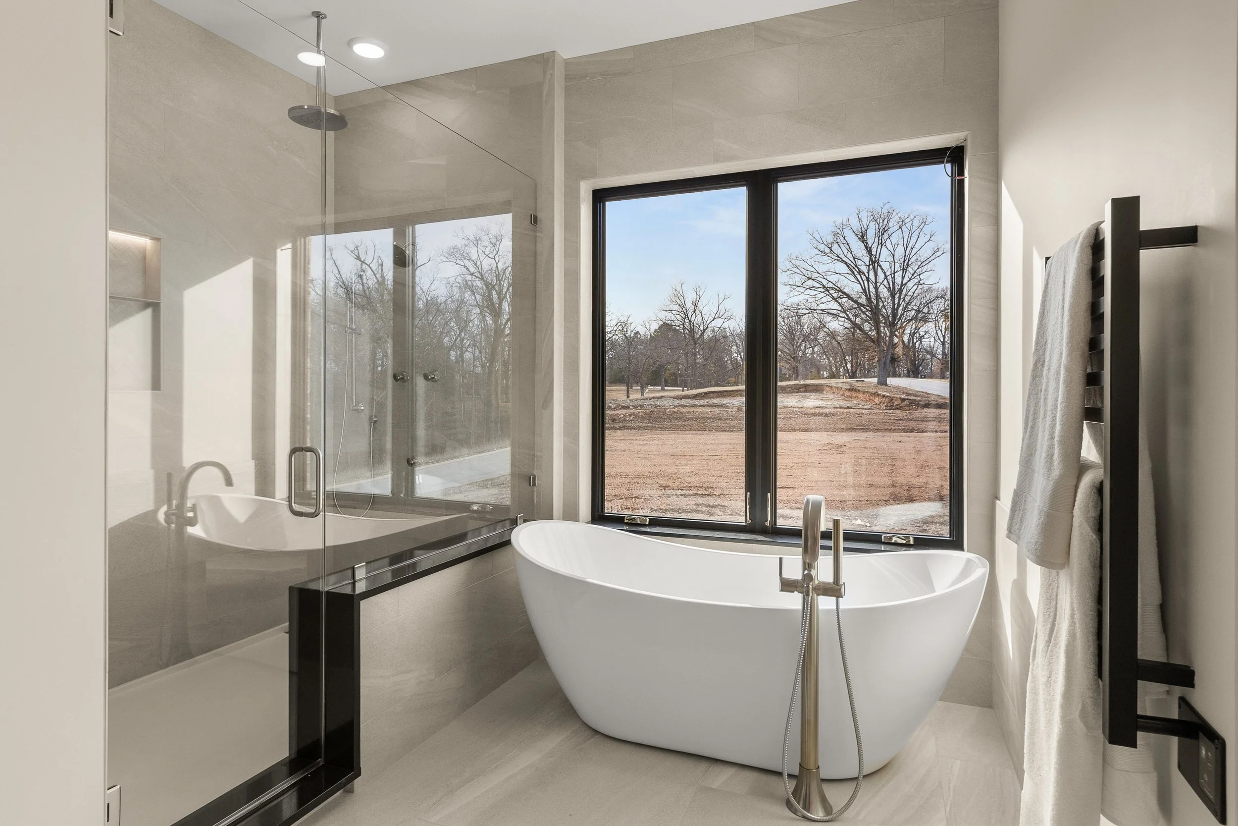 From the walk-in shower, tub, and heated towel rack this newly built home has all the custom features!