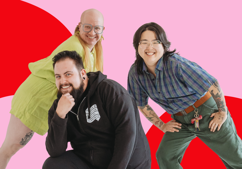 Three smiling people posing together against a colorful abstract background.