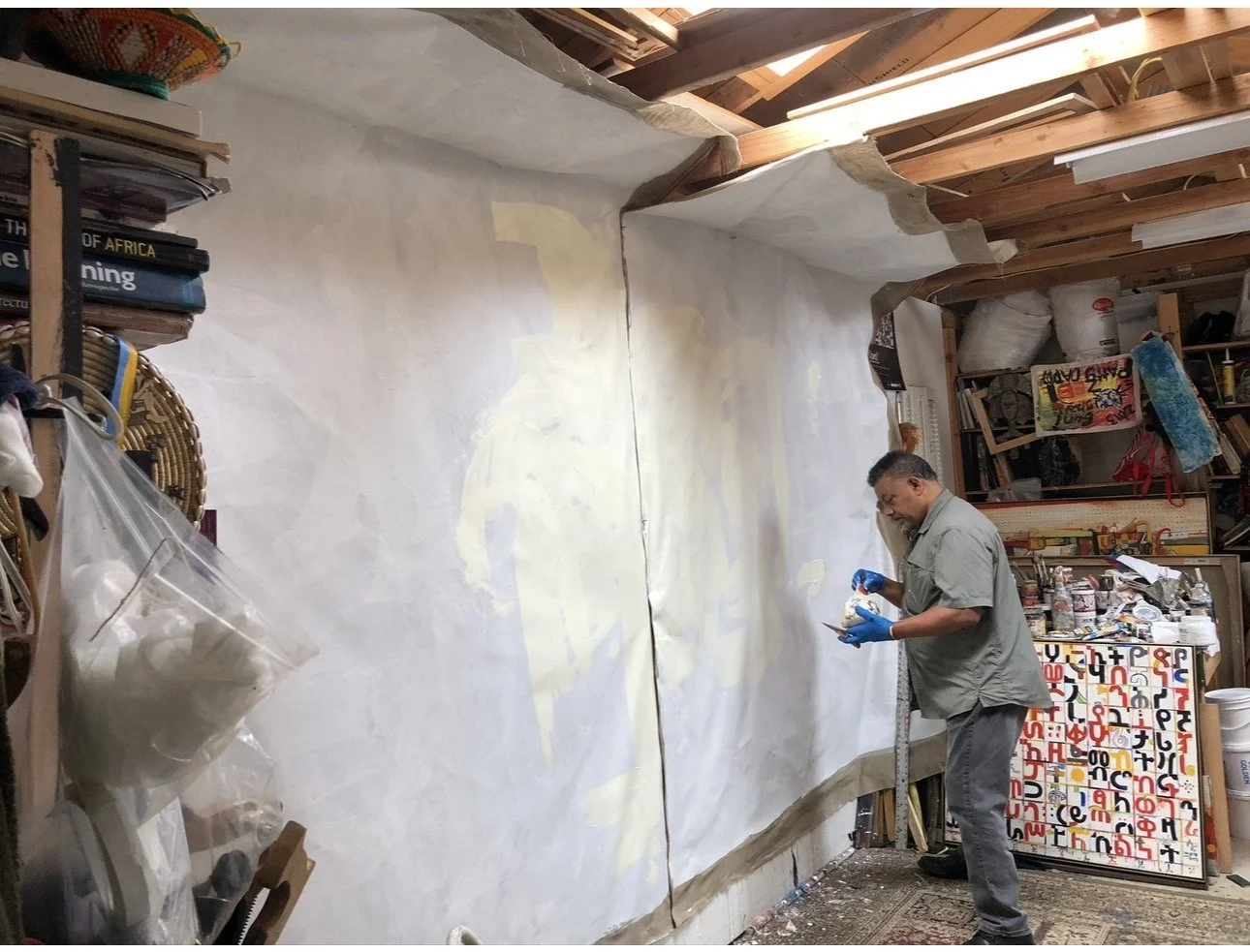Wosene begins work on his large-scale painting For Love of Freedom, 2018.