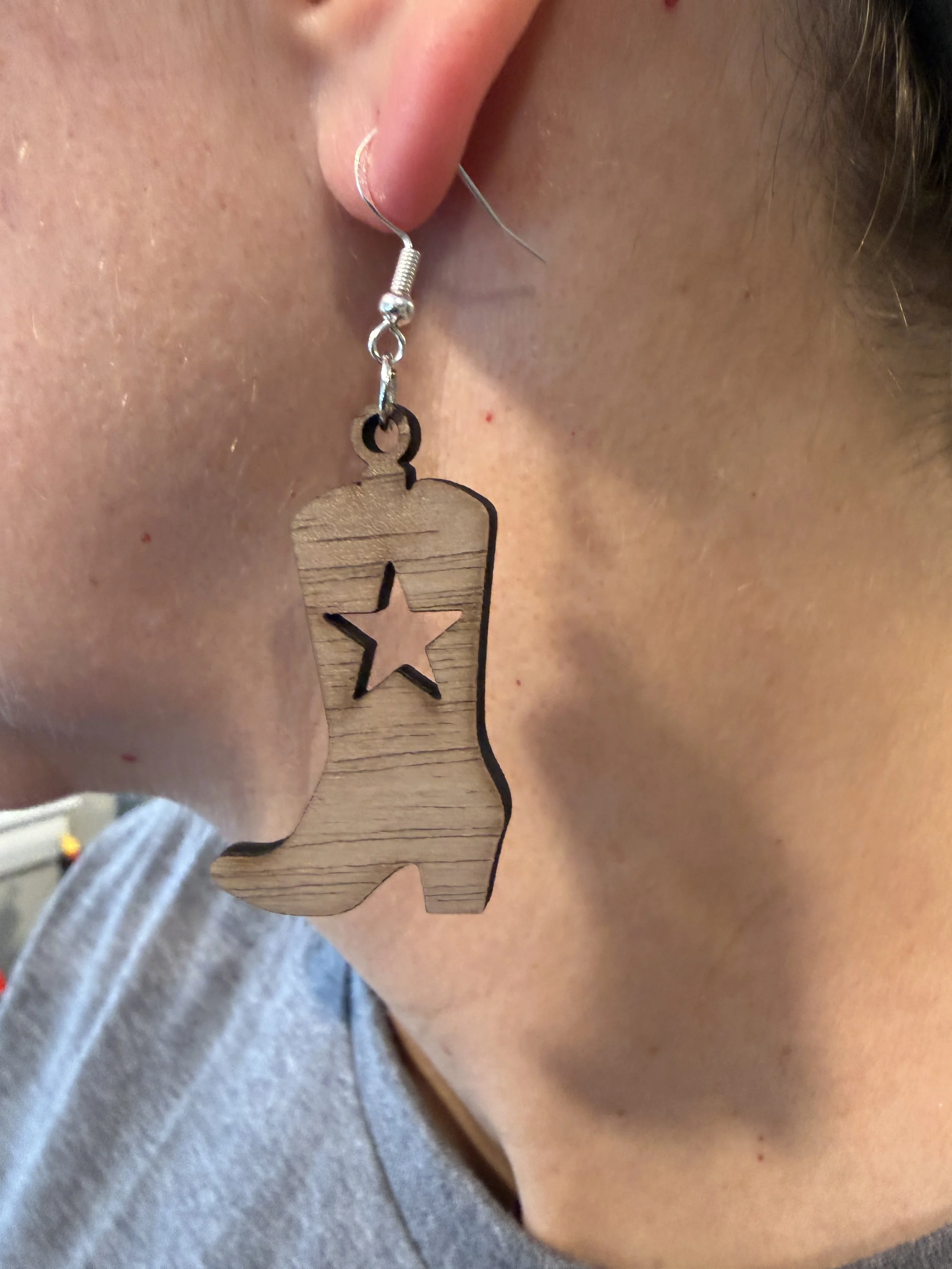 Walnut Earrings - Cowboy Boot Design with Star on ear.JPG