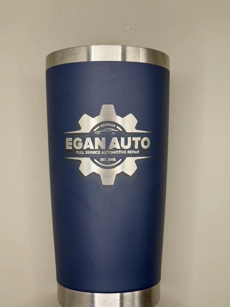 Blue and silver travel tumbler with the logo of EGAN AUTO, an automotive repair service established in 2008.