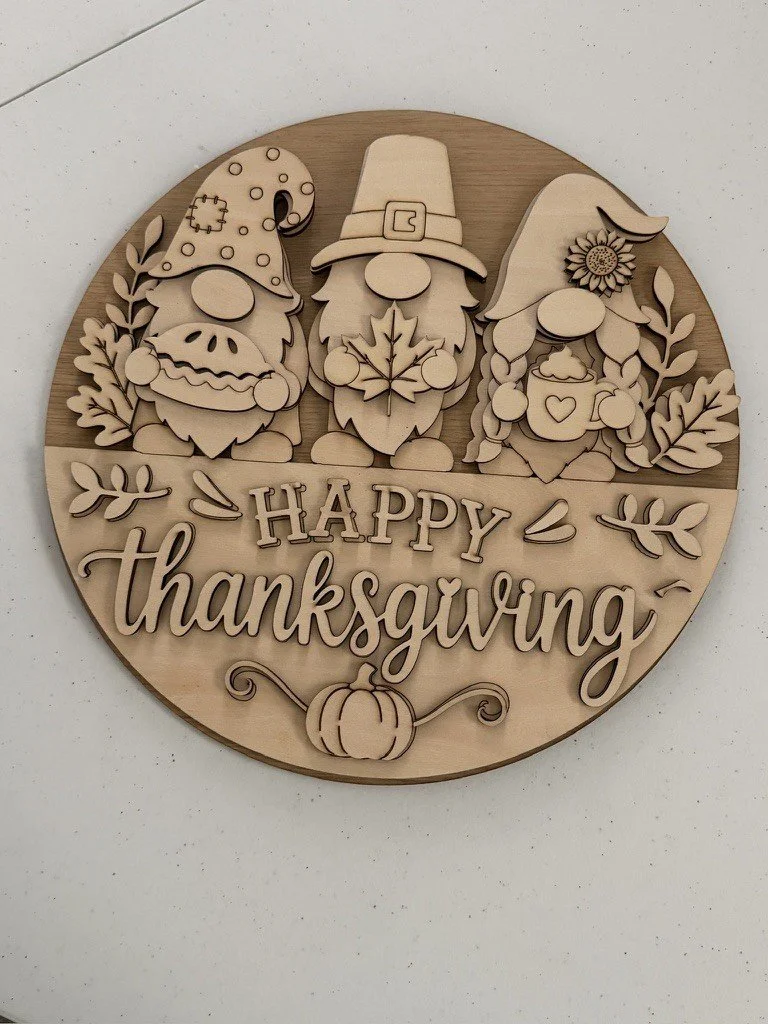 Unfinished layered wood Happy Thanksgiving round sign kit with three gnomes holding pie, maple leaf and cocoa, 12 inch