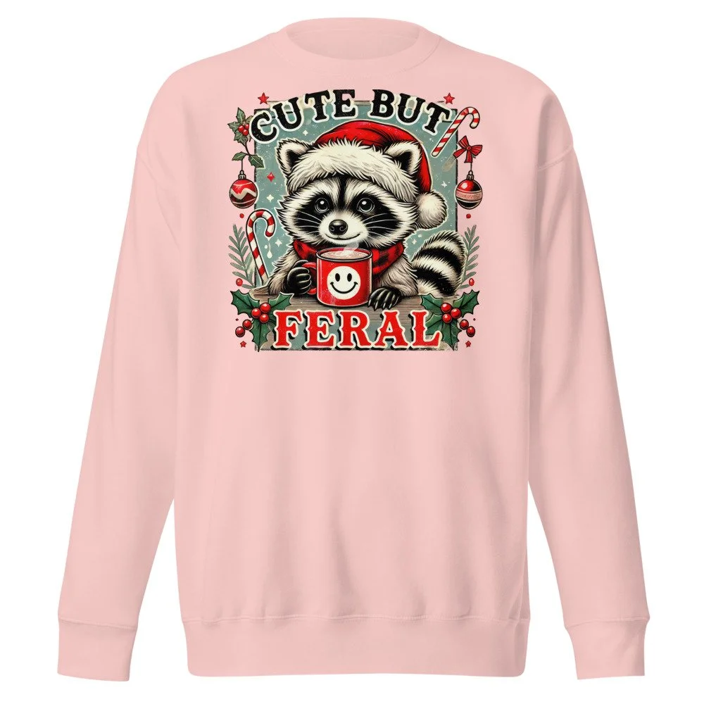 Cute But Feral Christmas raccoon sweatshirt in Light Pink, front