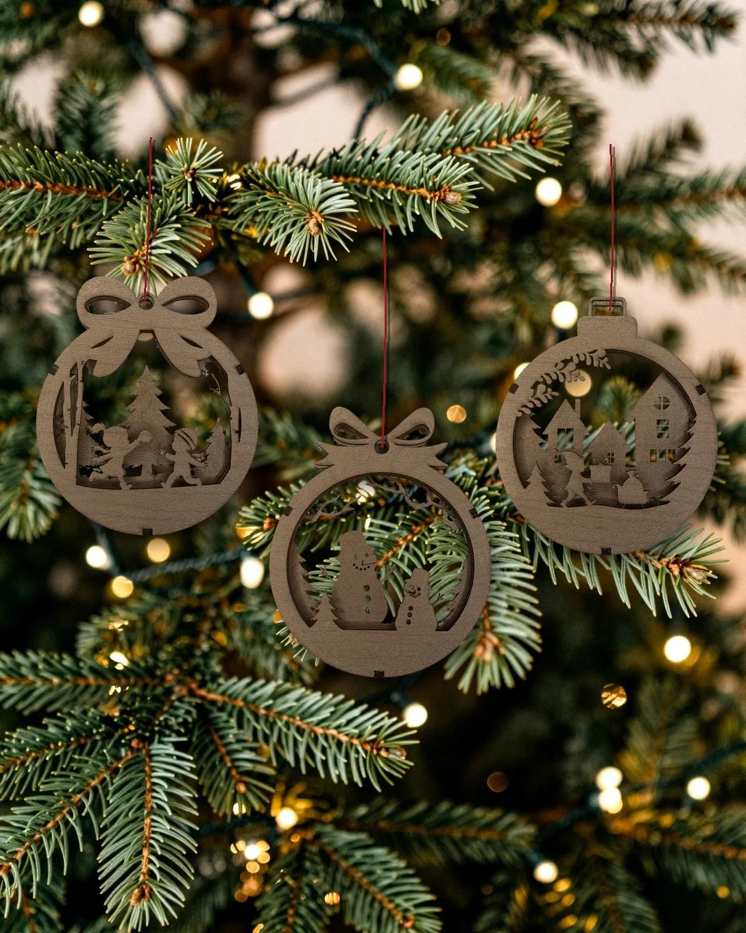 Holiday Village 3-pack of walnut layered wood ornaments hanging together on a Christmas tree