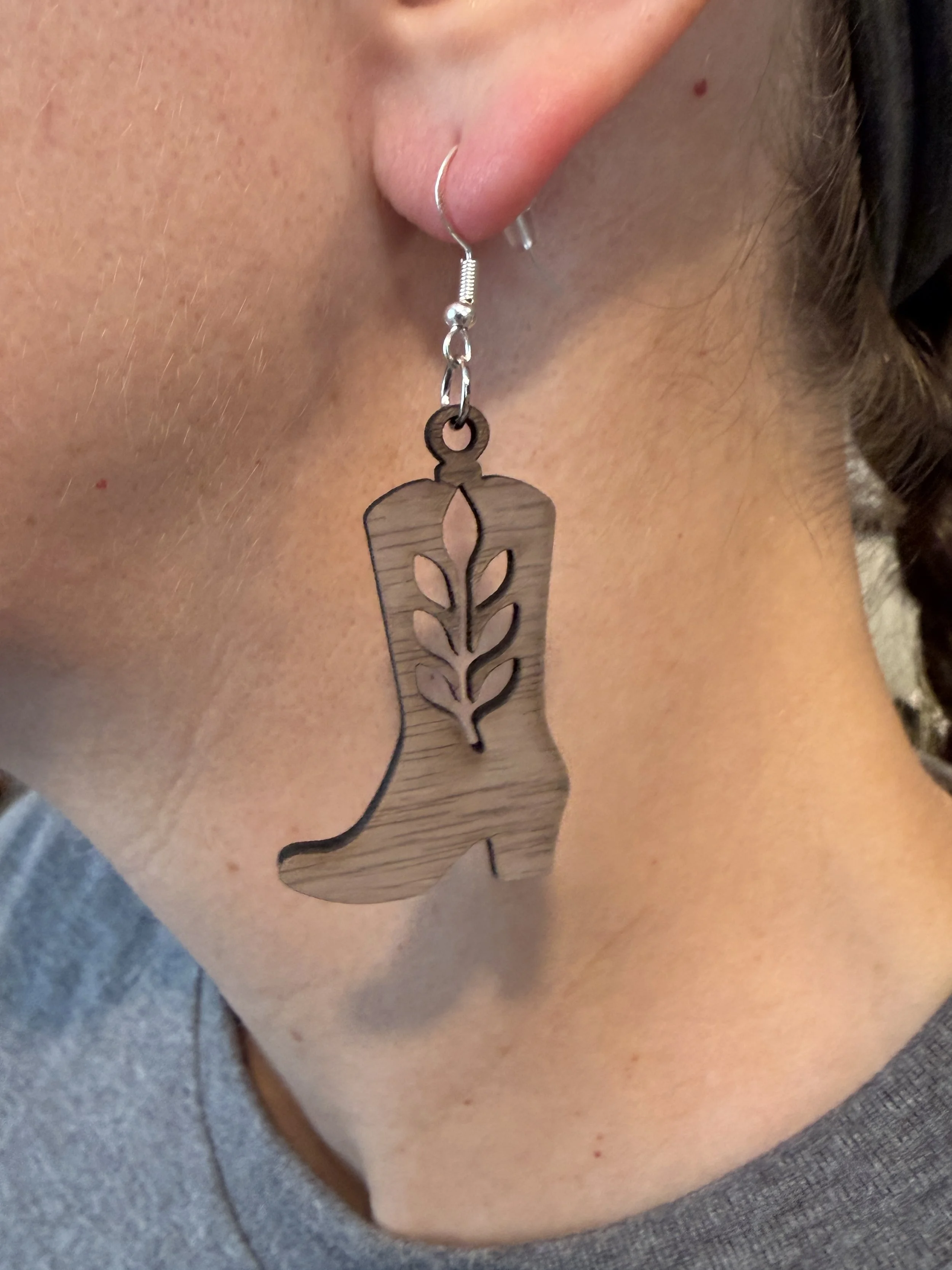 Walnut Earrings - Cowboy Boot Leaf Design on ear.JPG