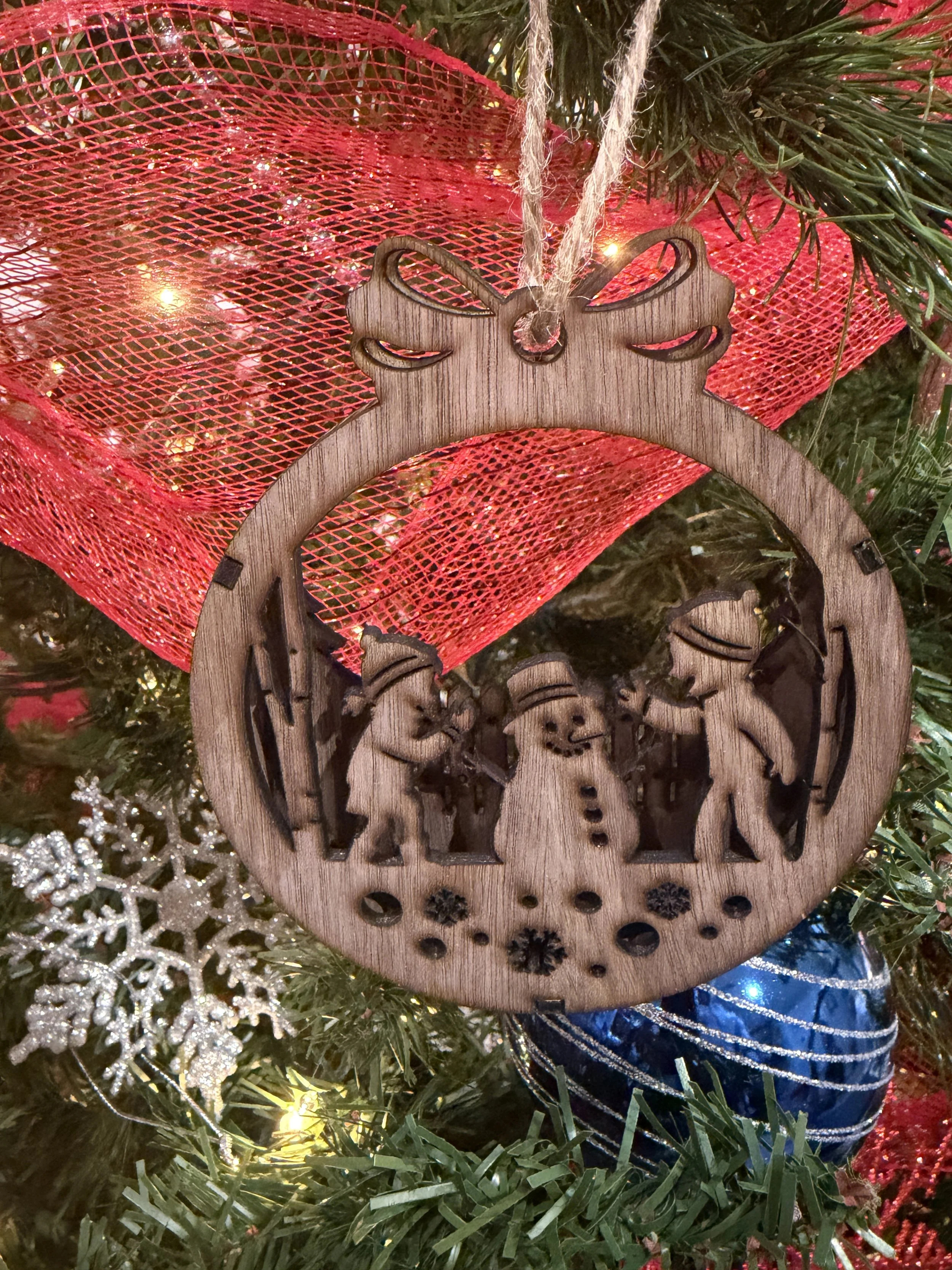 Walnut Ornament - Kids building Snowman.JPG