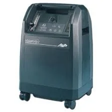 A large gray and black medical or laboratory device with touch screen controls and wheels at the bottom.