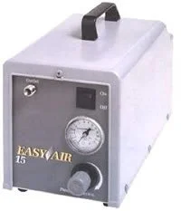 White medical device with pressure gauge, digital display, and control knob, labeled 'EASY AIR 15'.