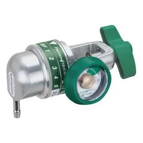 A medical device with a metal cylindrical body, a green dial with numbers, and a clear lens, used for oxygen therapy.