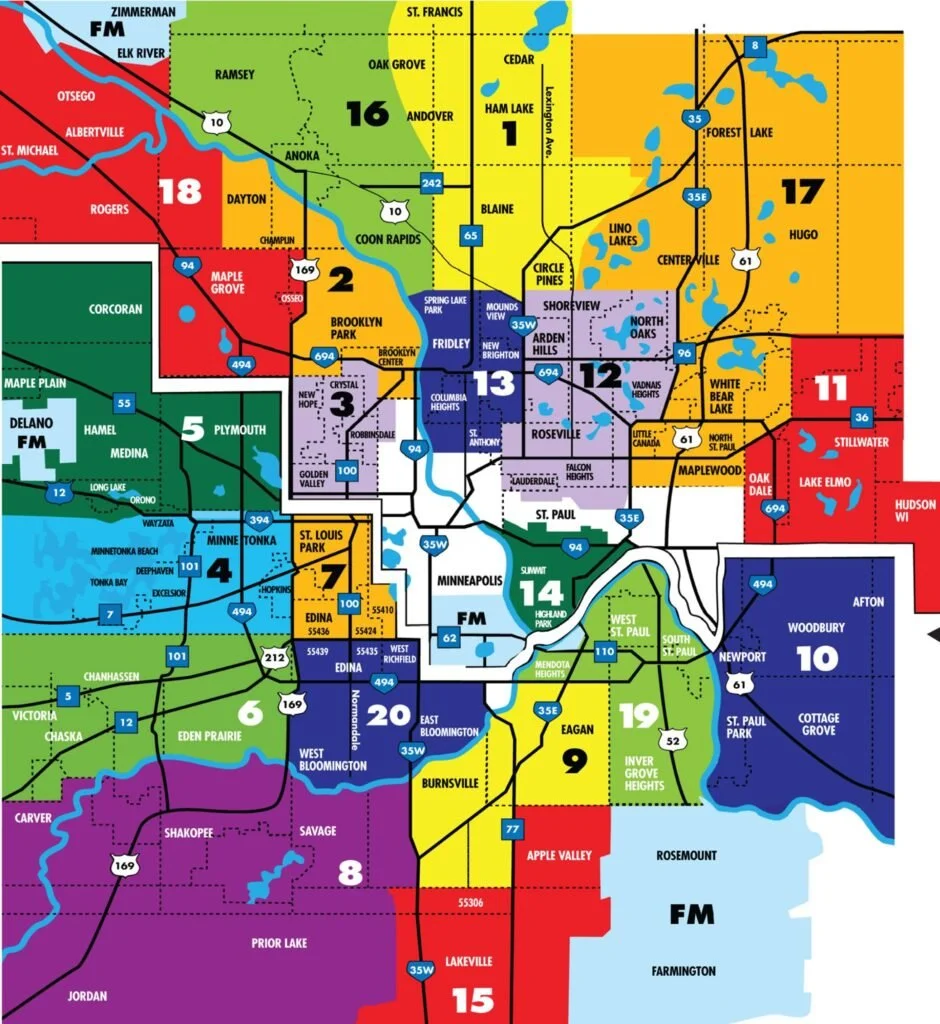A colorful map of the Minneapolis-St. Paul area divided into numbered districts, showing city boundaries, lakes, rivers, highways, and neighborhoods.
