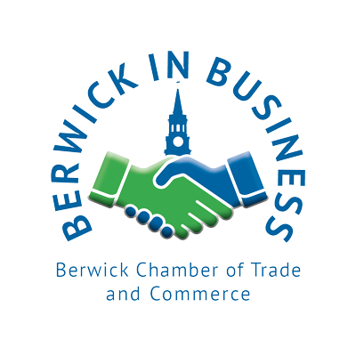 Logo of Berwick in Business, featuring a handshake with green and blue sleeves, a building steeple, and the text 'Berwick in Business' and 'Berwick Chamber of Trade and Commerce'.